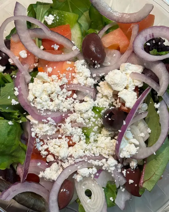 Greek salad with feta, olives, tomato and red onion